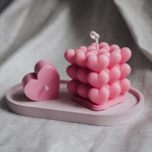 A unique square candle form with hearts. 